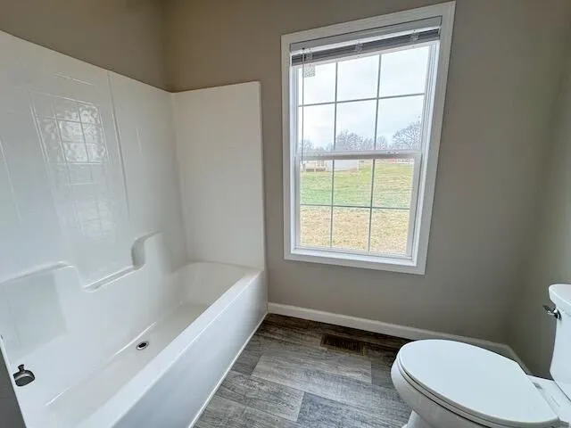 a bathroom with a double vanity sink and mirror with shower