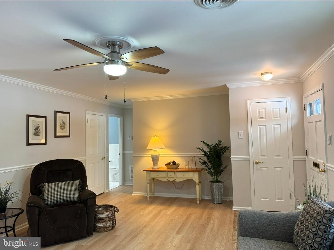 1105 Yardley Commons Yardley, PA 19067 - Photo 7 of 24 a living room with furniture and a ceiling fan