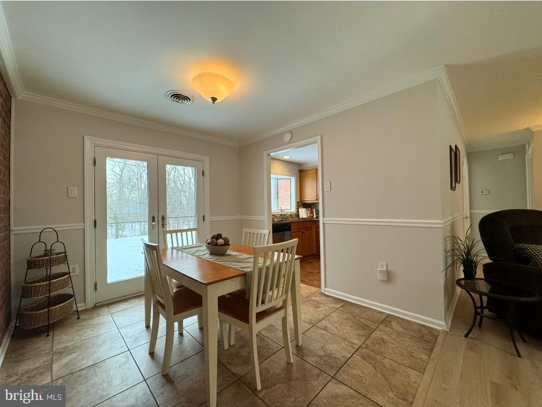 1105 Yardley Commons Yardley, PA 19067 - Photo 9 of 24 a view of a dining room with furniture and a window