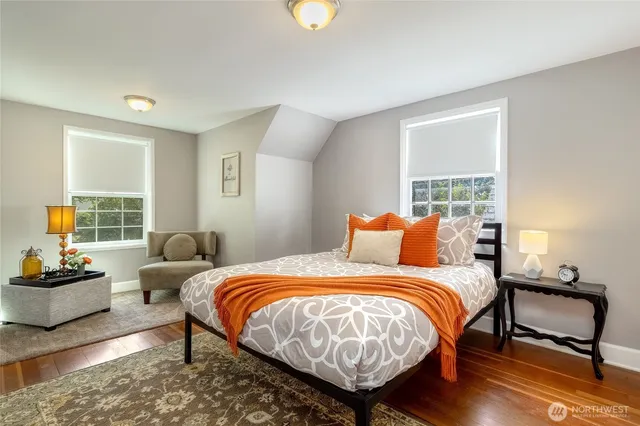 a bedroom with bed and window