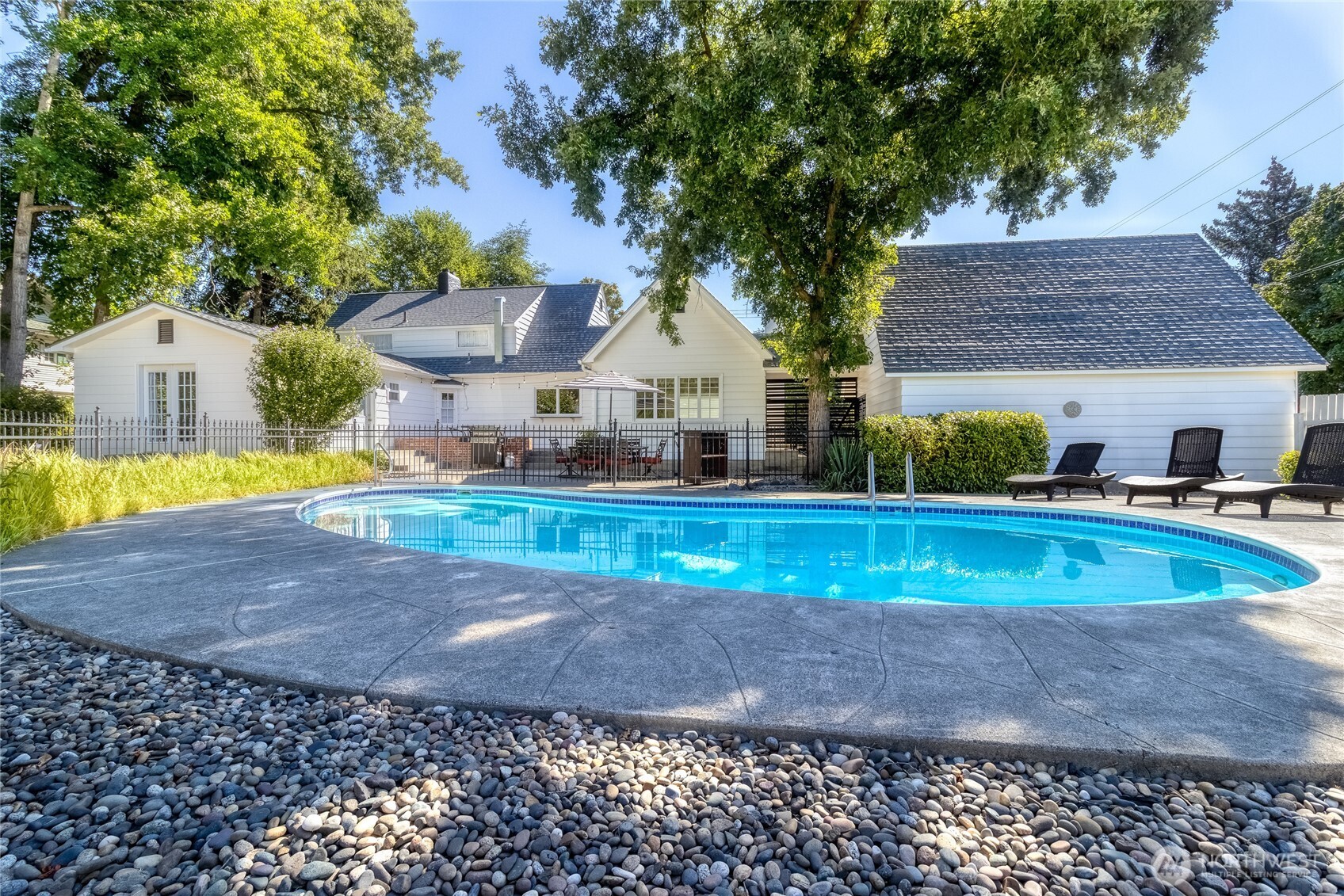 1402 Howard Street Walla Walla, WA 99362 - Photo 29 of 34 a view of a house with a yard and large trees