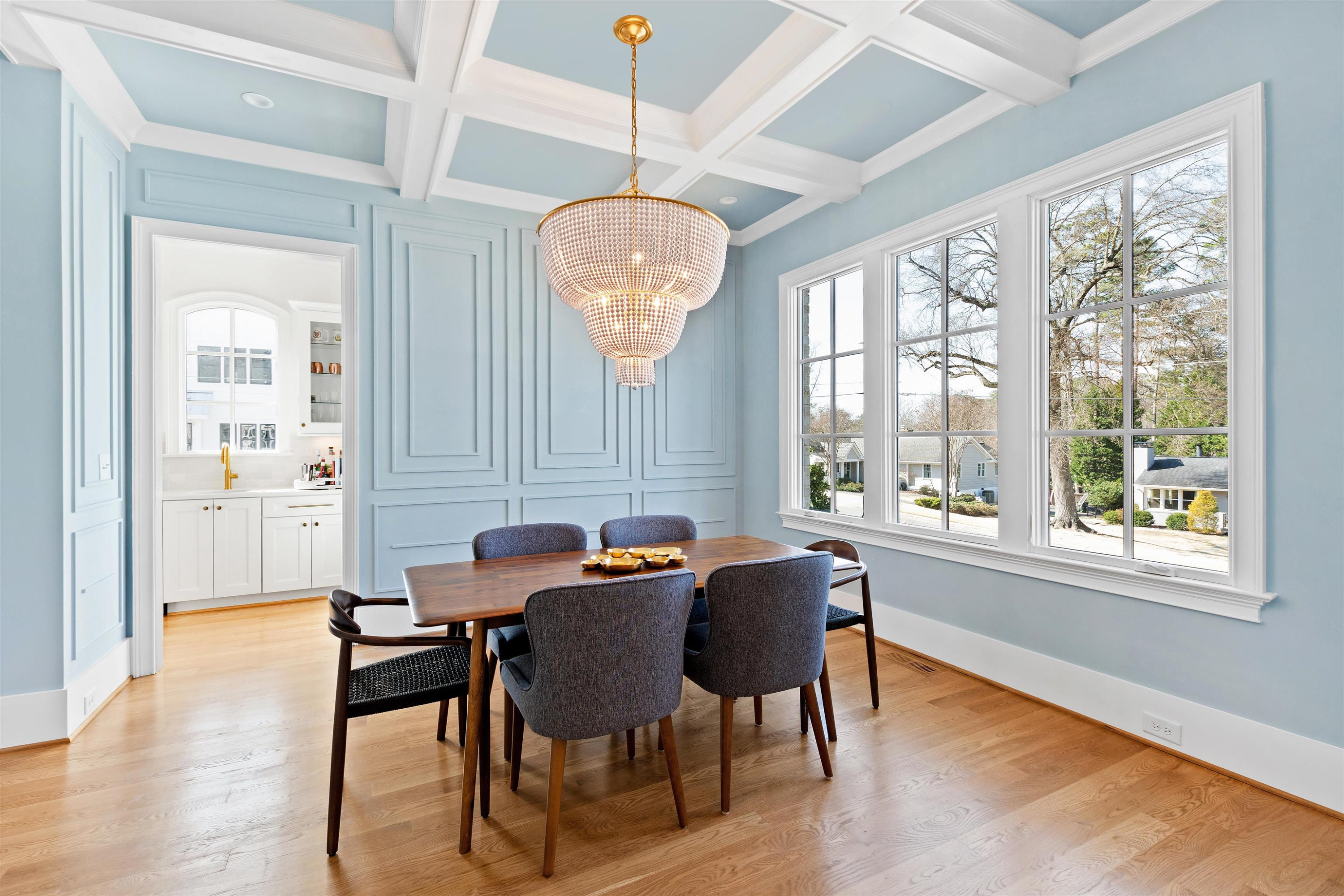 3314 Turnbridge Drive Raleigh, NC 27609 - Photo 5 of 64 a view of a dining room with furniture a chandelier and wooden floor