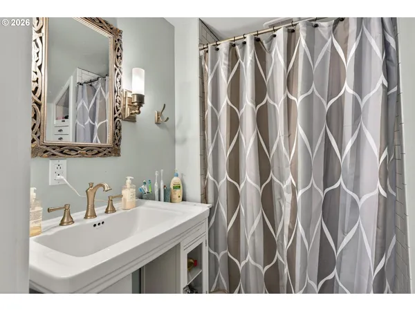 a bathroom with a sink and mirror
