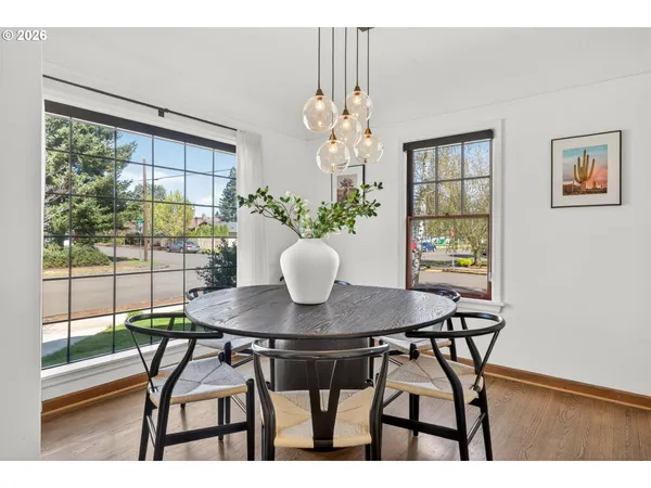 a view of a dining room with furniture and a window