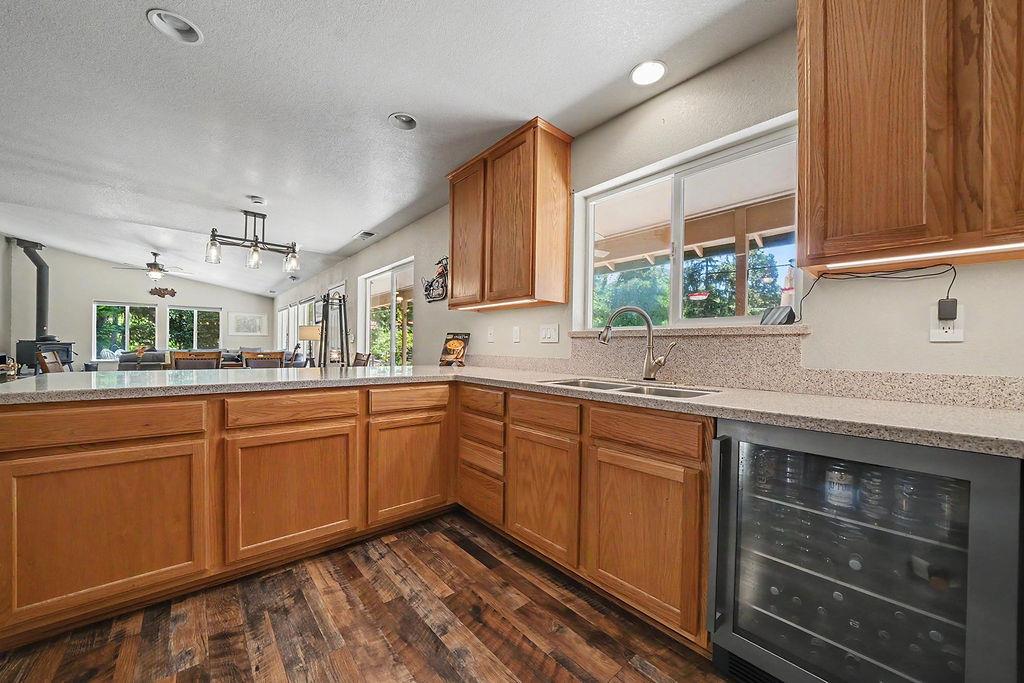 26845 Spring Court Pioneer, CA 95666 - Photo 8 of 89 a kitchen with stainless steel appliances granite countertop wooden cabinets a sink and dishwasher