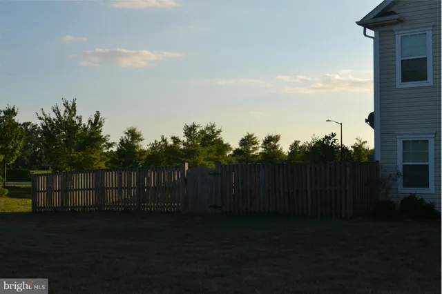 a view of a fence in a yard