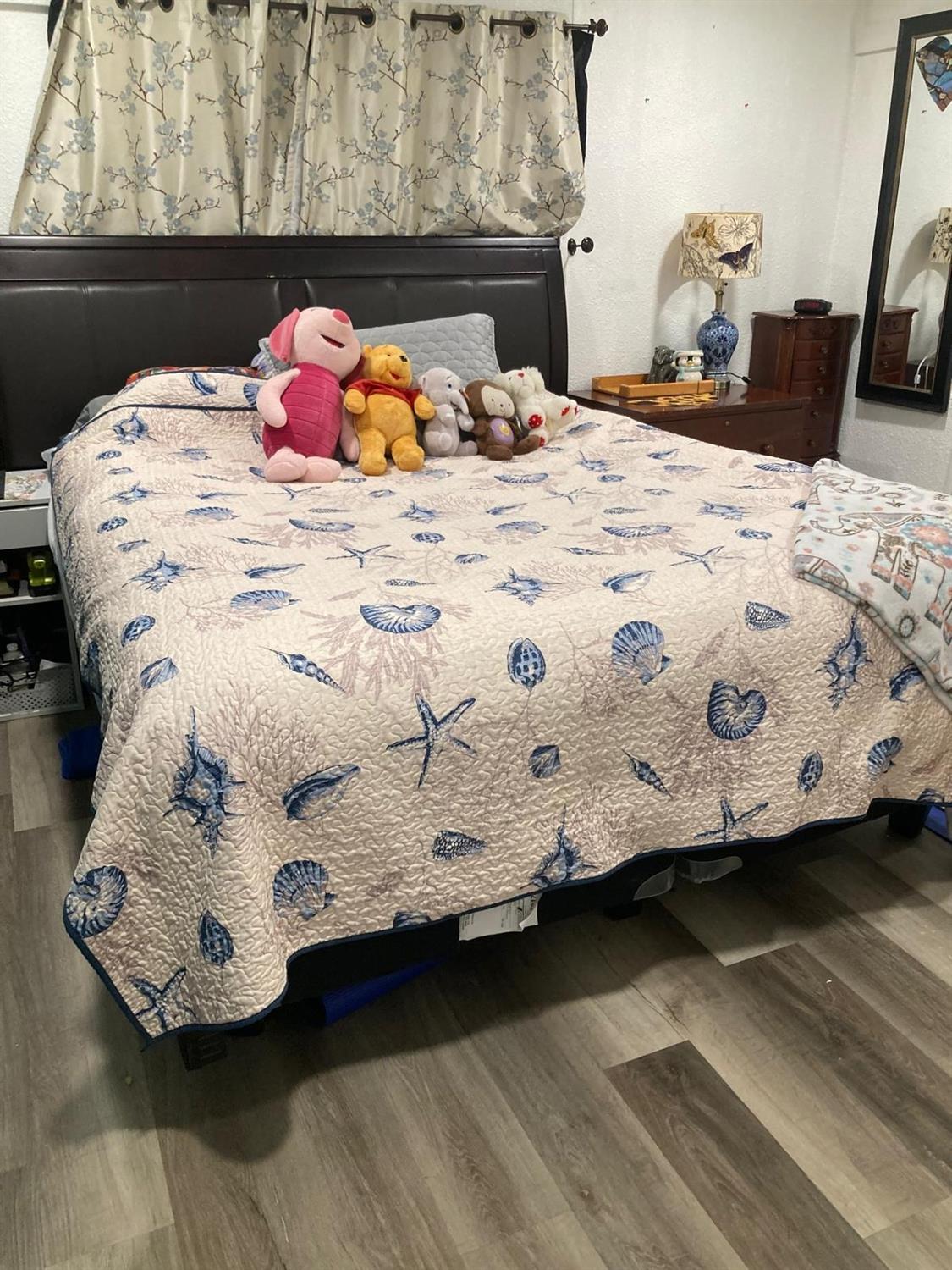 3950 Mack Road, Unit 182 Sacramento, CA 95823 - Photo 12 of 35 a bed sitting in a bedroom next to a window with dresser