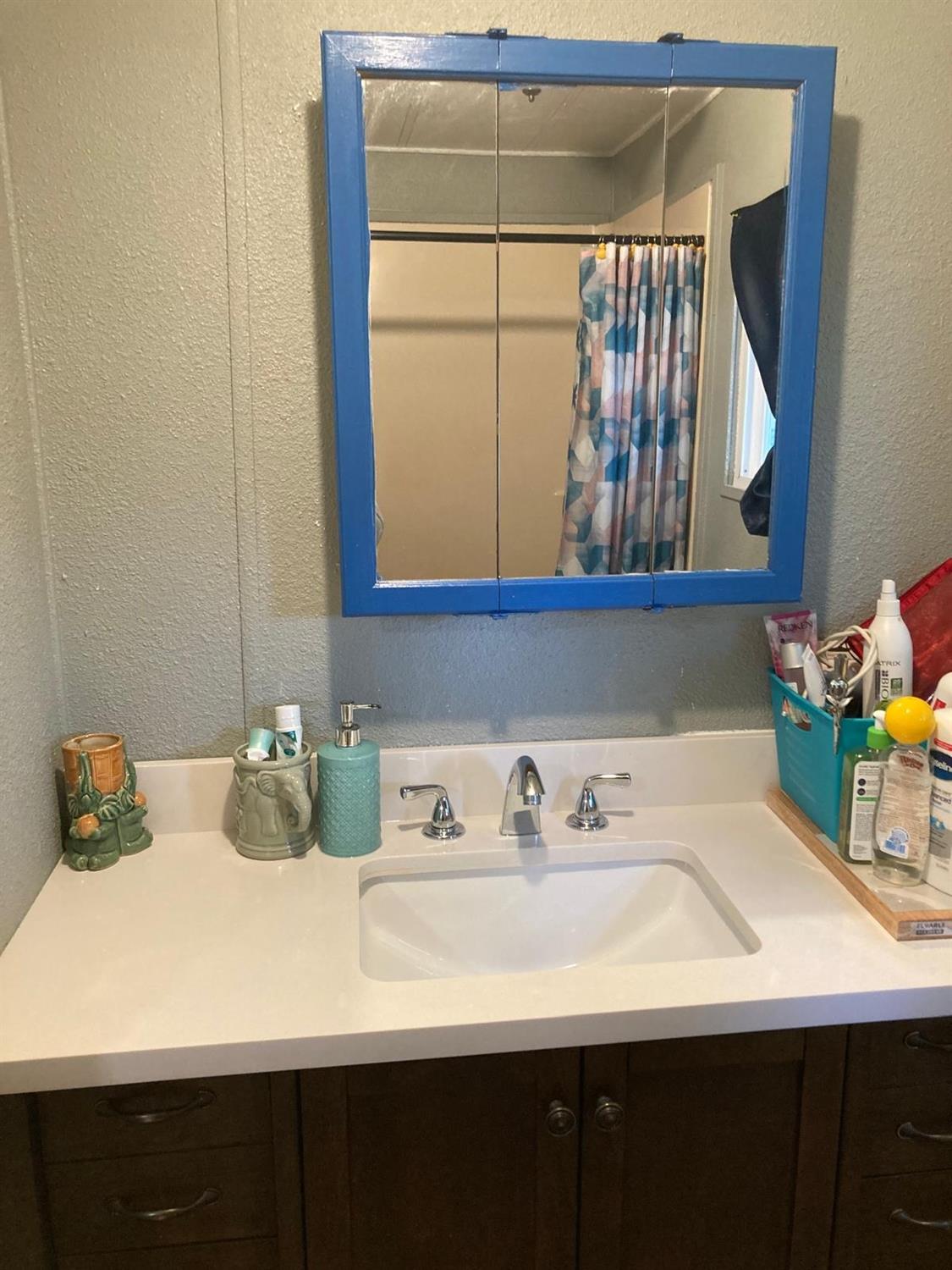 3950 Mack Road, Unit 182 Sacramento, CA 95823 - Photo 14 of 35 a bathroom with a sink and a window
