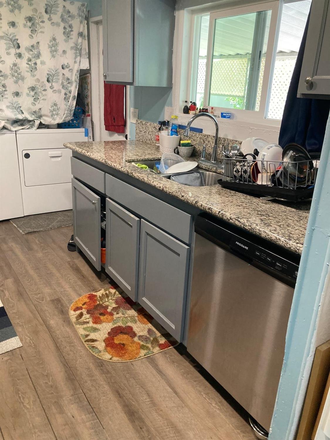 3950 Mack Road, Unit 182 Sacramento, CA 95823 - Photo 19 of 35 a kitchen with stainless steel appliances granite countertop a sink stove and cabinets
