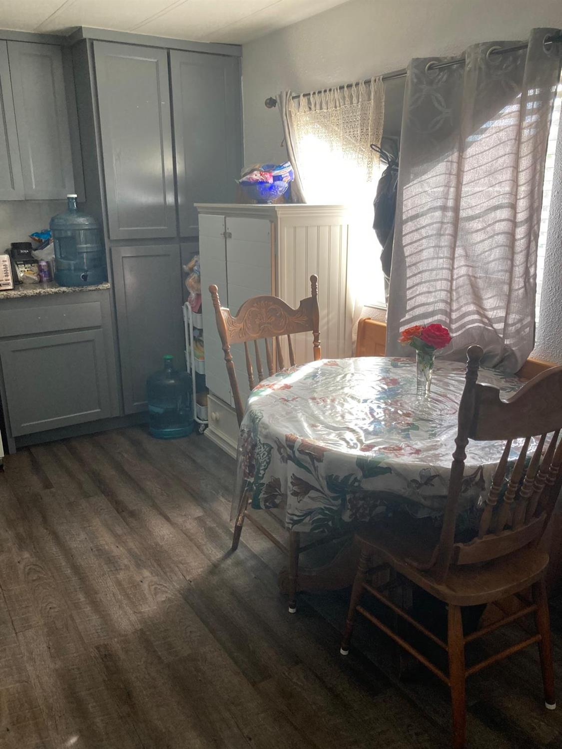 3950 Mack Road, Unit 182 Sacramento, CA 95823 - Photo 21 of 35 a kitchen with kitchen island a stove a sink and a refrigerator