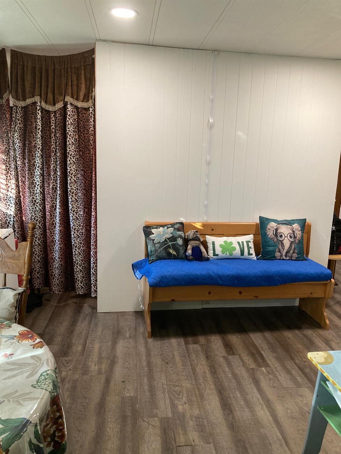 3950 Mack Road, Unit 182 Sacramento, CA 95823 - Photo 24 of 35 a view of a room with furniture and clothes