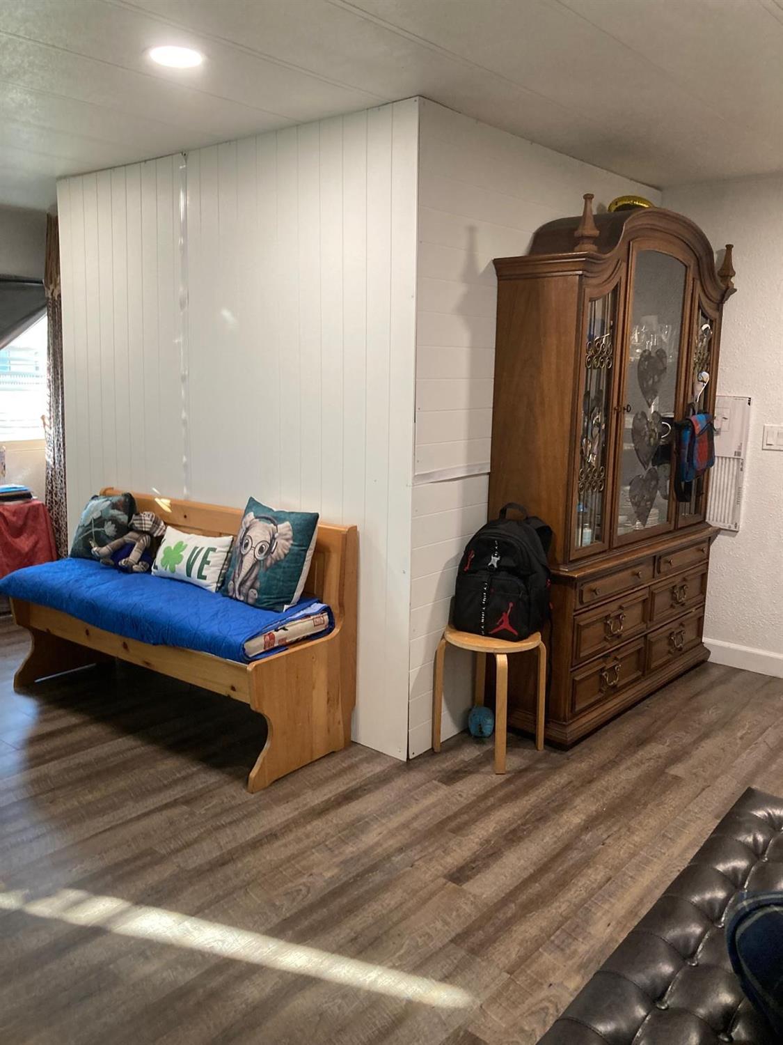 3950 Mack Road, Unit 182 Sacramento, CA 95823 - Photo 25 of 35 a living room with furniture and wooden floor