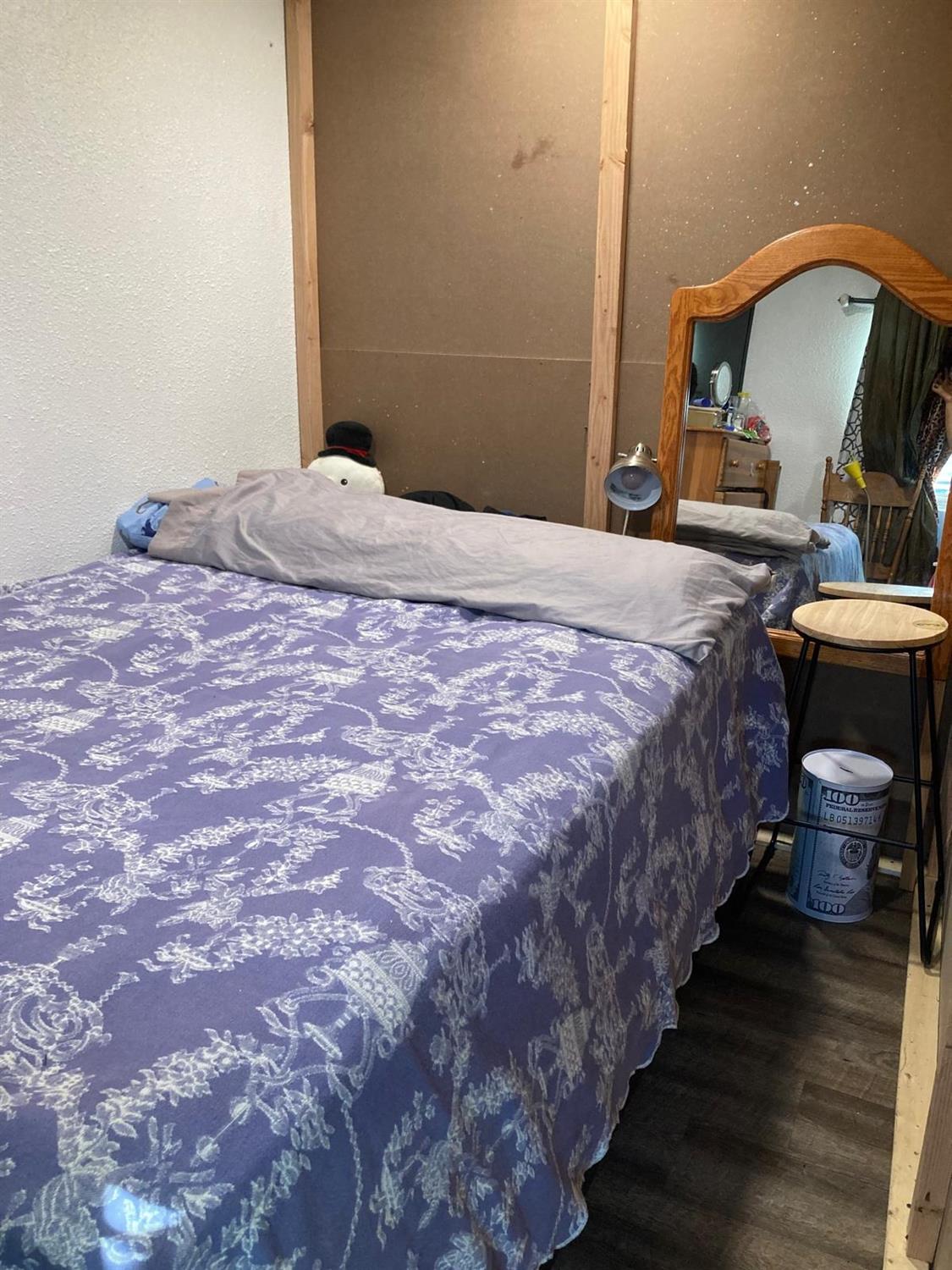 3950 Mack Road, Unit 182 Sacramento, CA 95823 - Photo 27 of 35 a bedroom with a bed and wooden floor