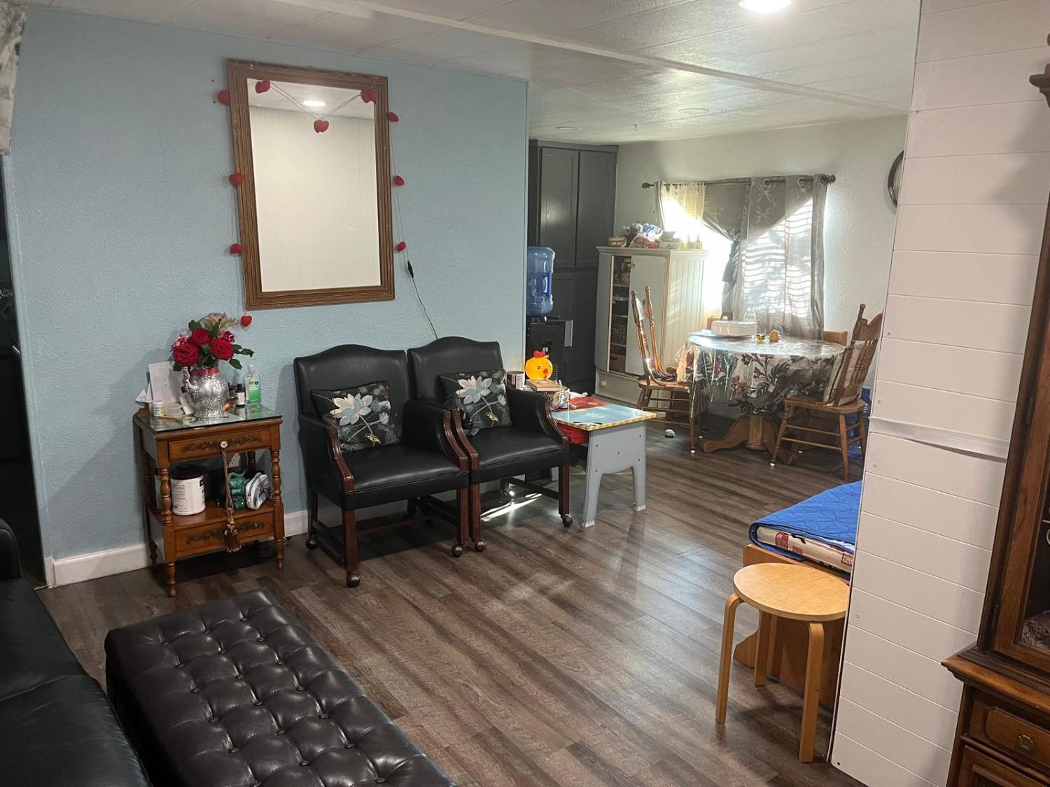 3950 Mack Road, Unit 182 Sacramento, CA 95823 - Photo 28 of 35 a living room with furniture and wooden floor