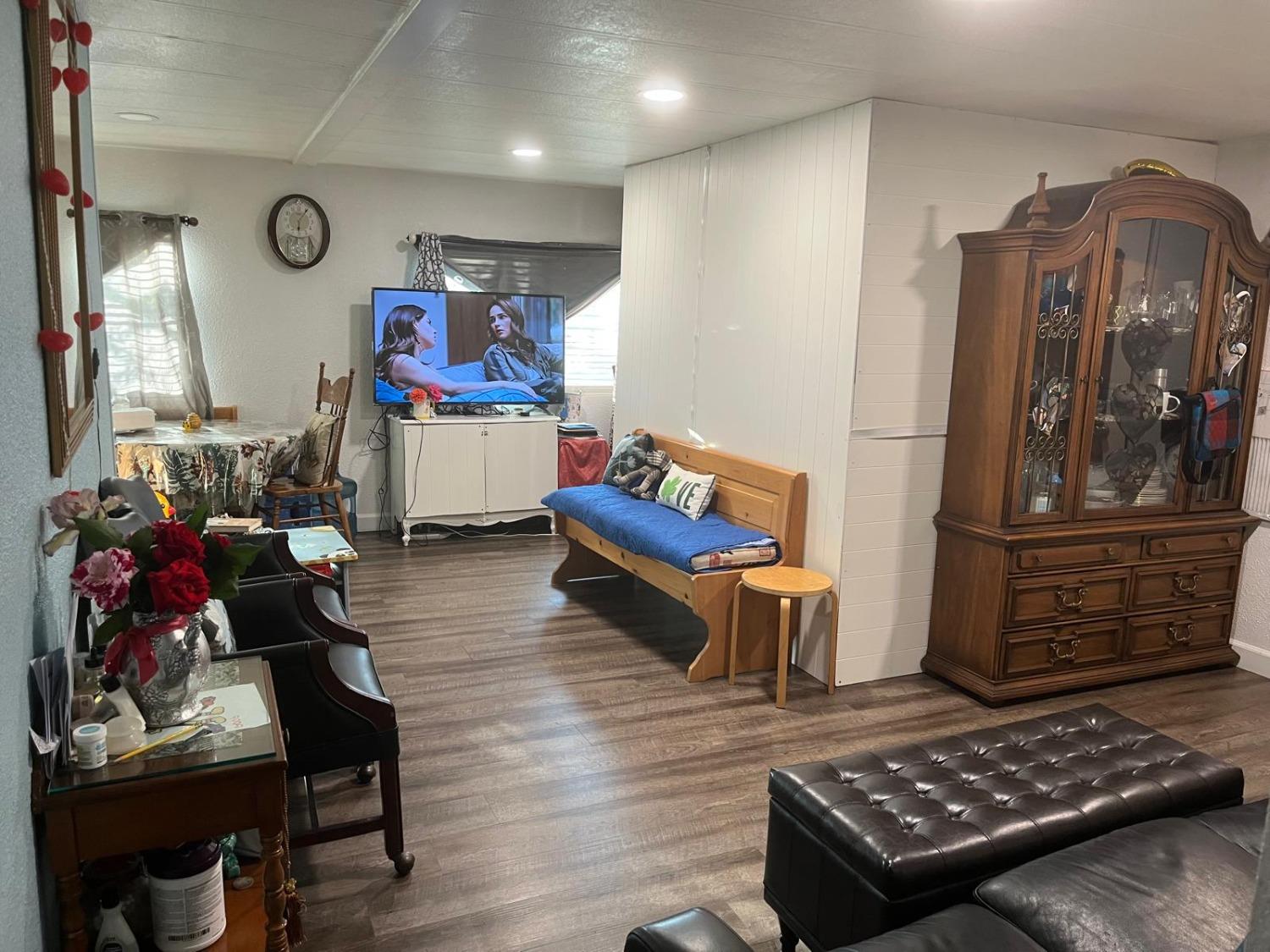3950 Mack Road, Unit 182 Sacramento, CA 95823 - Photo 29 of 35 a living room with furniture and wooden floor
