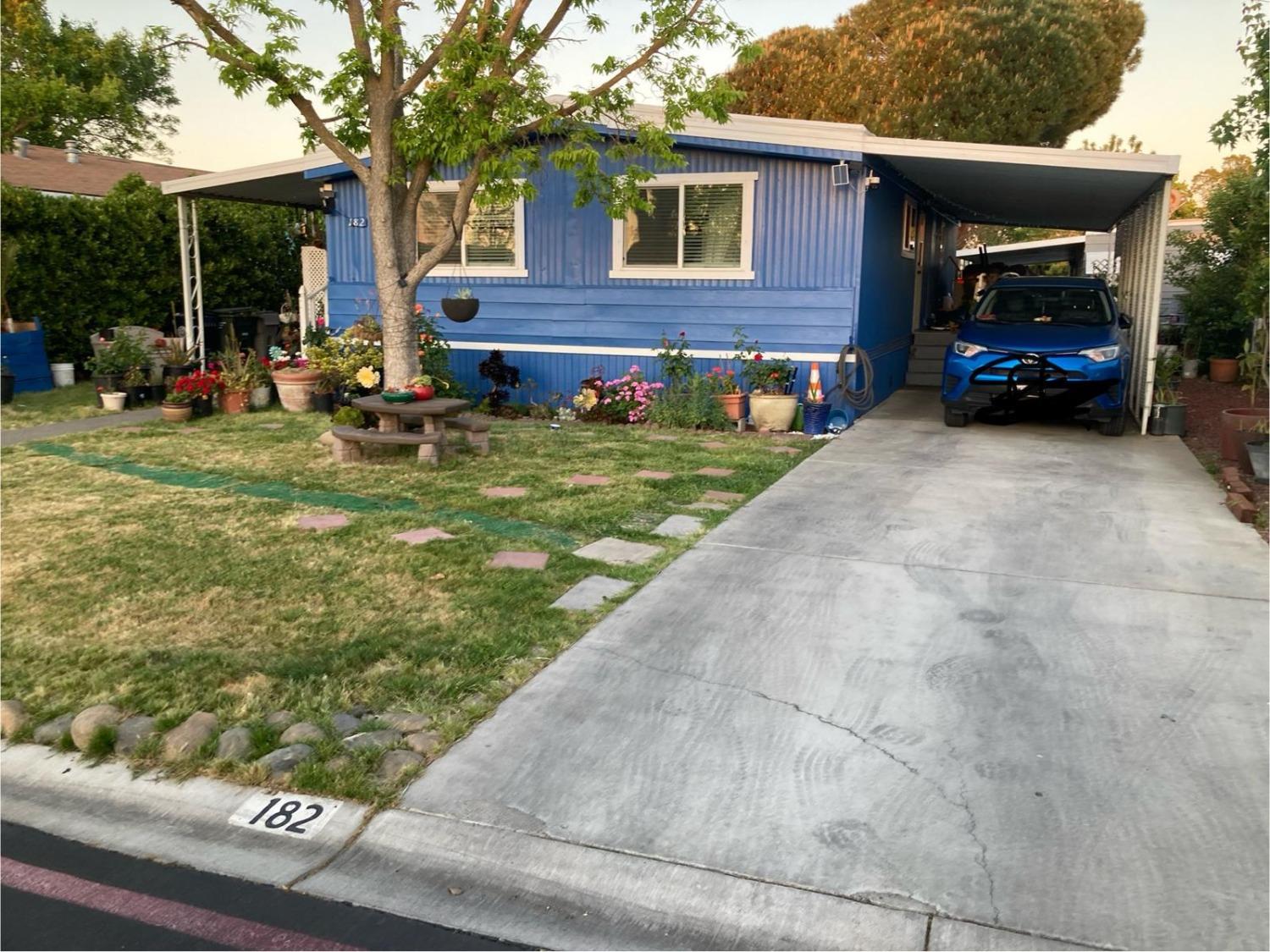 3950 Mack Road, Unit 182 Sacramento, CA 95823 - Photo 31 of 35 a view of a house with a yard and sitting area
