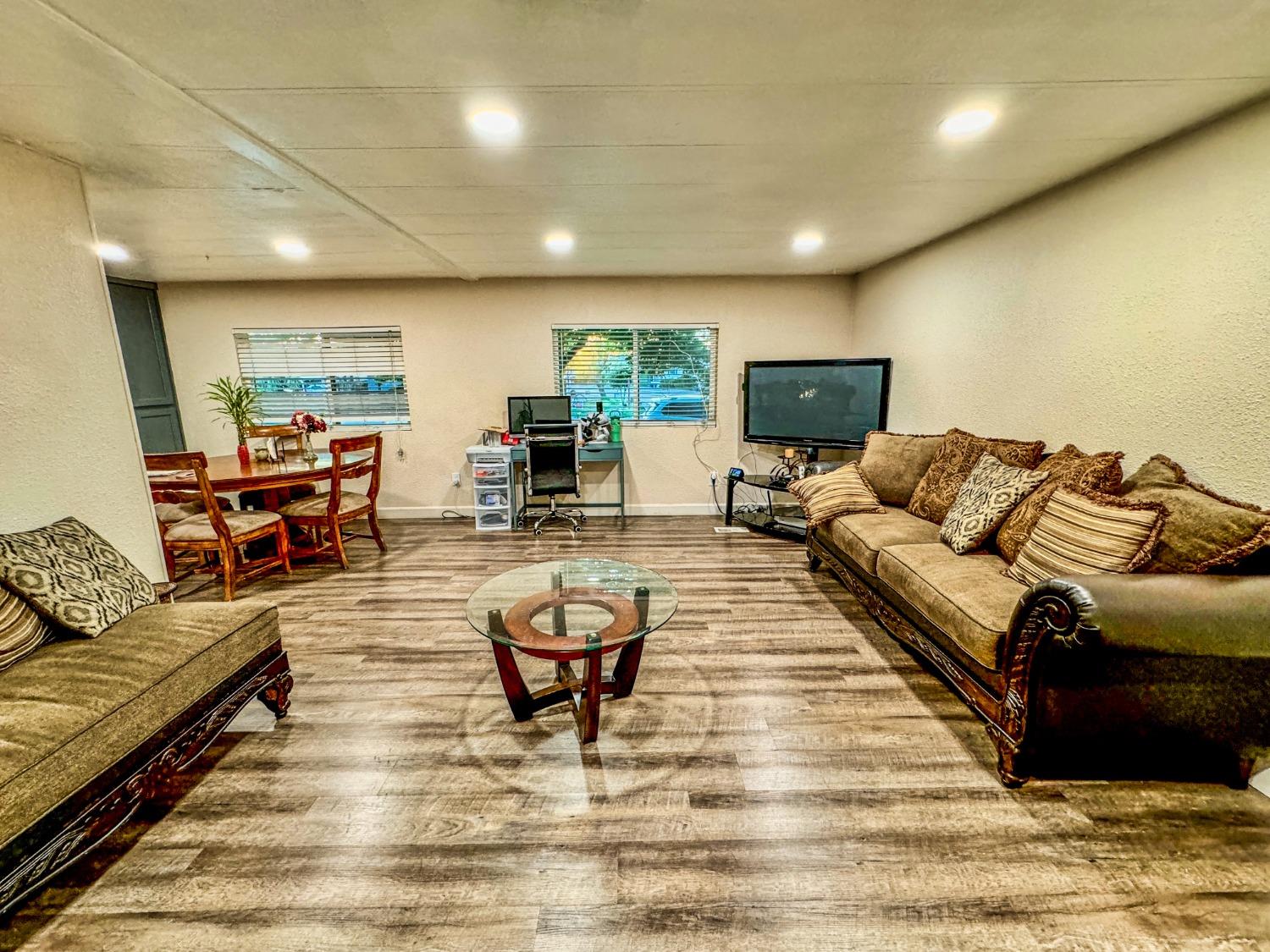 3950 Mack Road, Unit 182 Sacramento, CA 95823 - Photo 5 of 35 a living room with furniture and a wooden floor