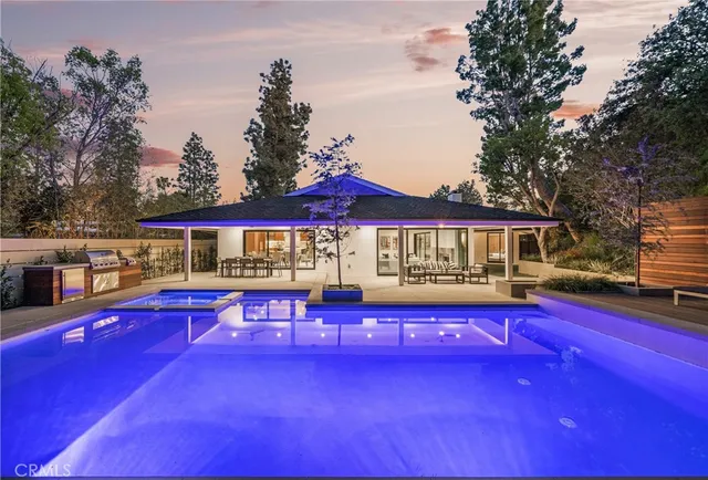 a view of a house with pool yard and patio
