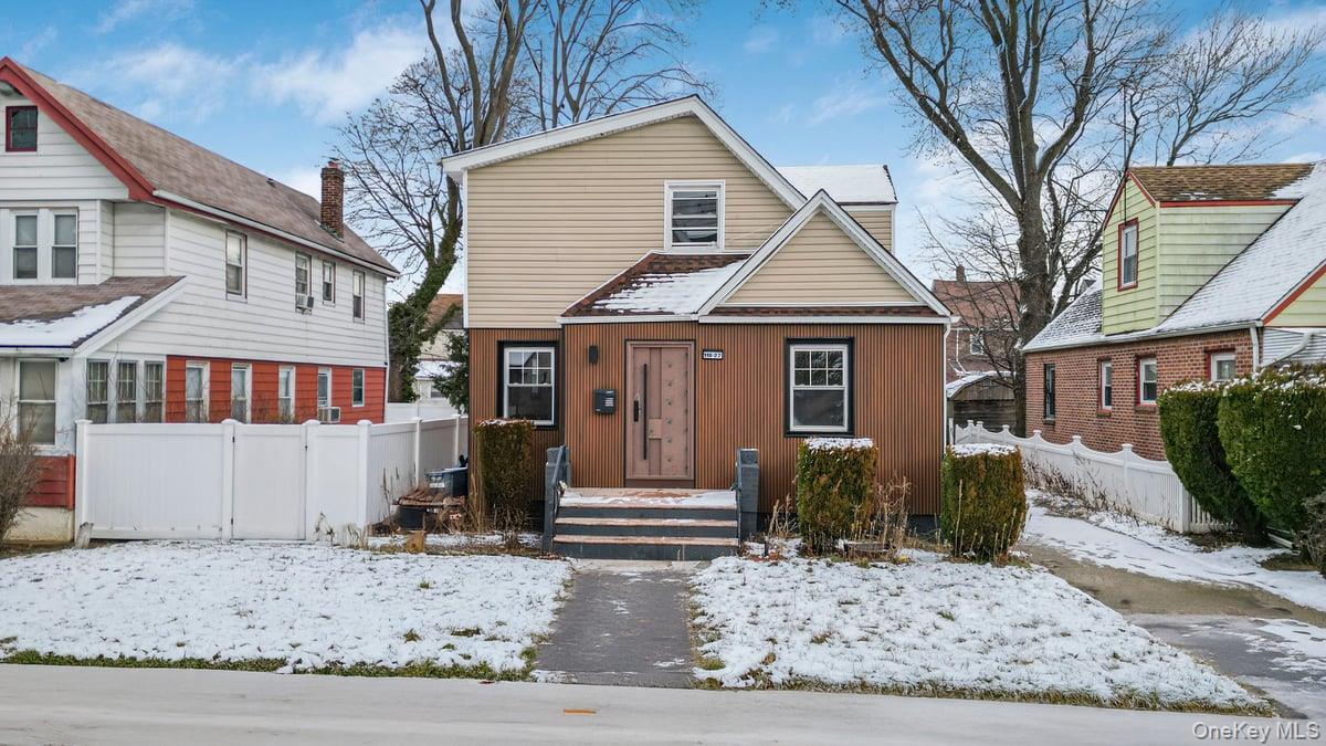 118-27 201st Street Queens, NY 11412 - Photo 1 of 36 a front view of a house with garden