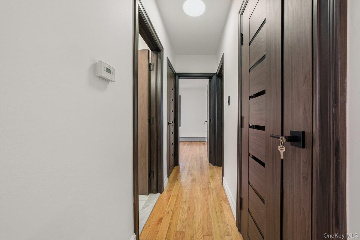 118-27 201st Street Queens, NY 11412 - Photo 14 of 36 a view of a bathroom from the hallway
