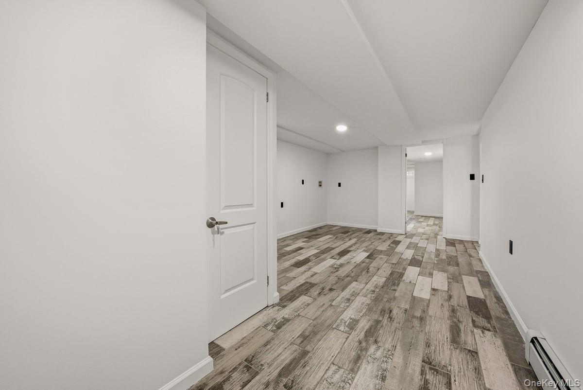 118-27 201st Street Queens, NY 11412 - Photo 28 of 36 a view of a livingroom with wooden floor