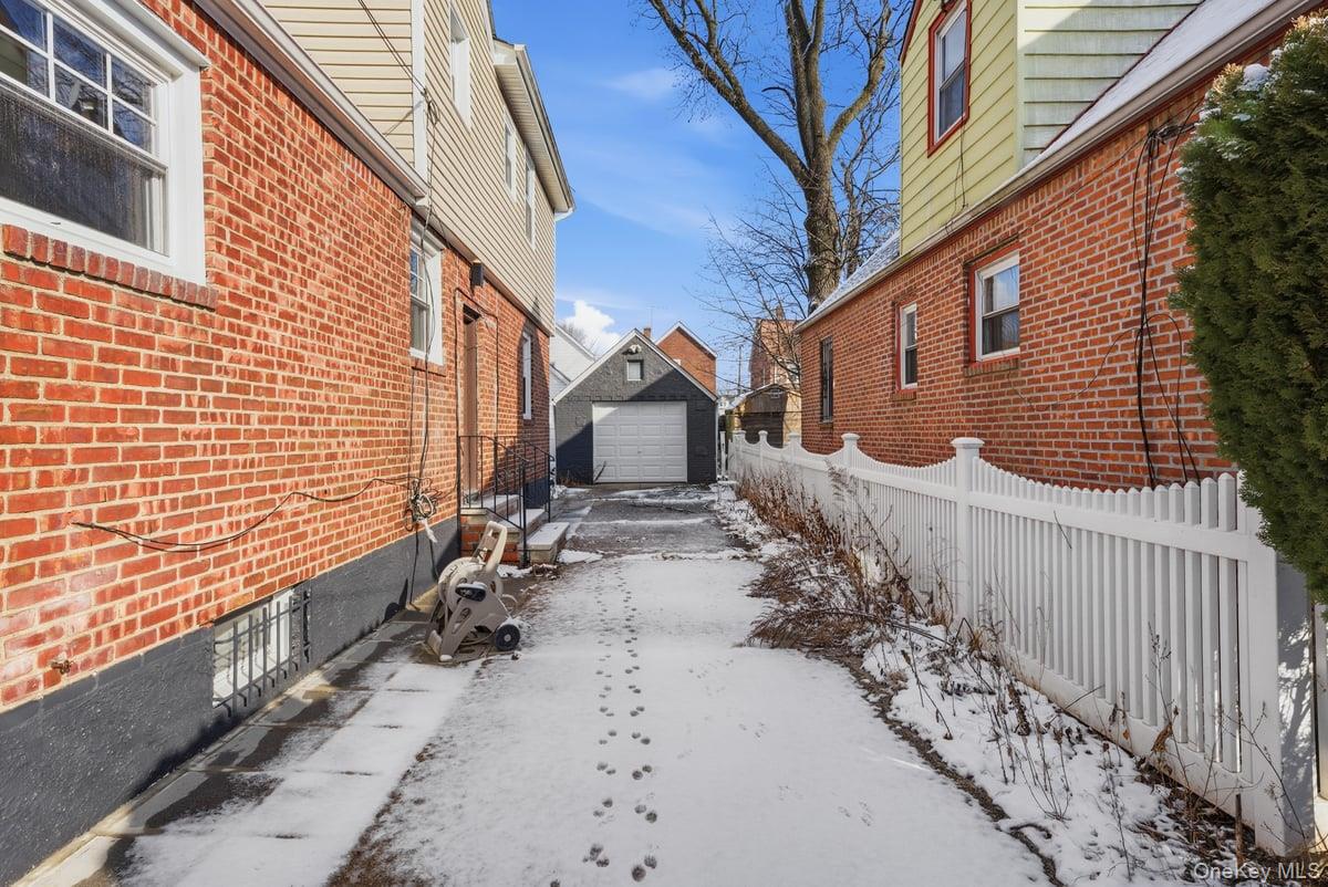 118-27 201st Street Queens, NY 11412 - Photo 33 of 36 a view of a house with wooden fence