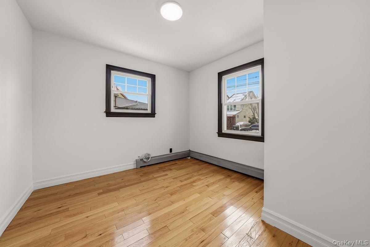 118-27 201st Street Queens, NY 11412 - Photo 5 of 36 a view of empty room with wooden floor