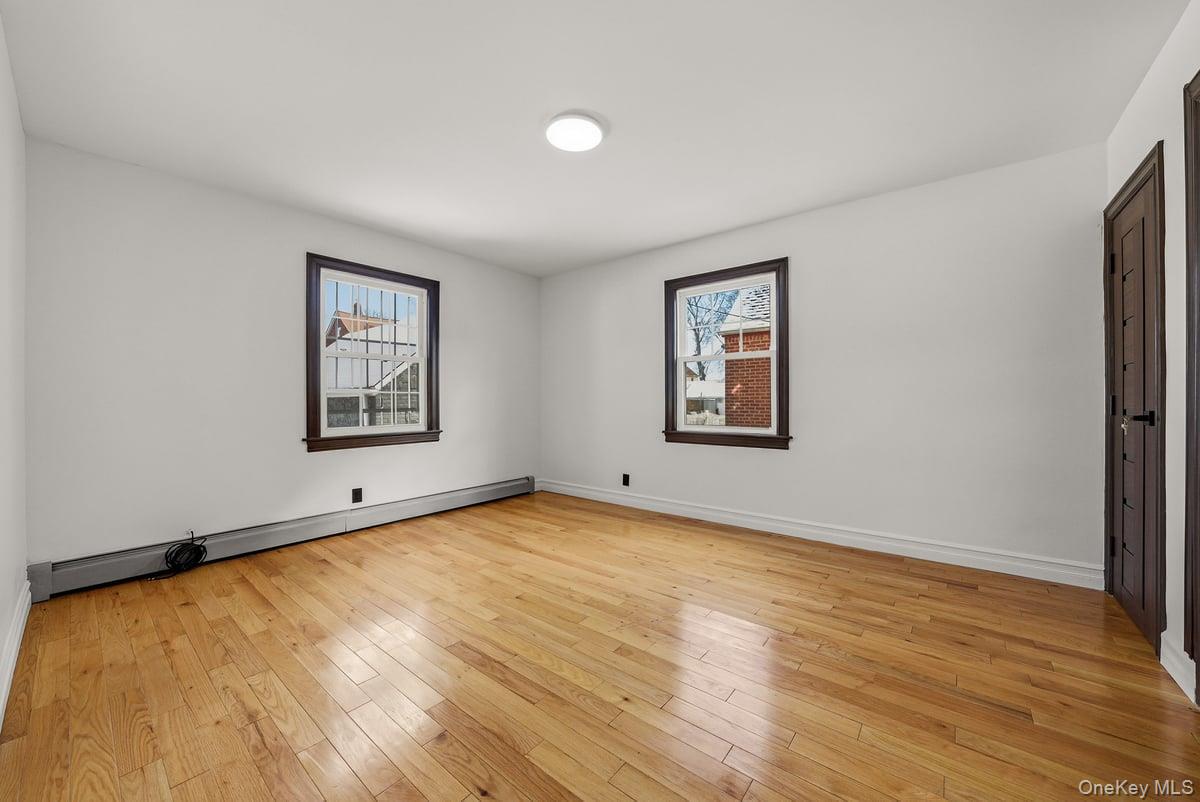 118-27 201st Street Queens, NY 11412 - Photo 10 of 36 a view of a room with window and wooden floor