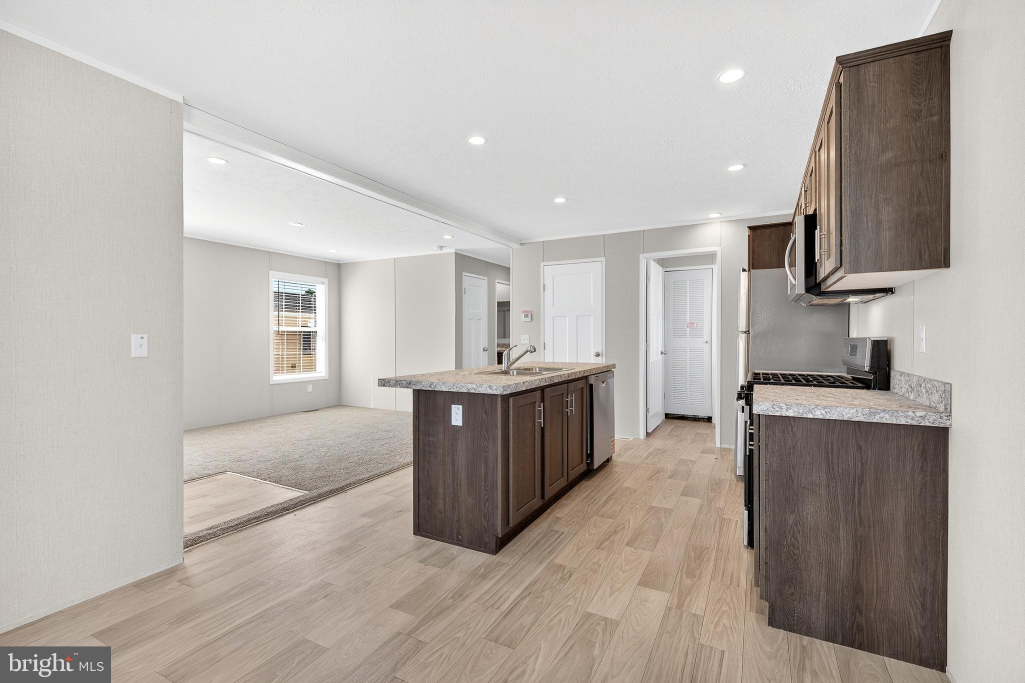 201 Bordic Road Reading, PA 19606 - Photo 16 of 30 a large kitchen with stainless steel appliances granite countertop a large counter top a sink and a refrigerator