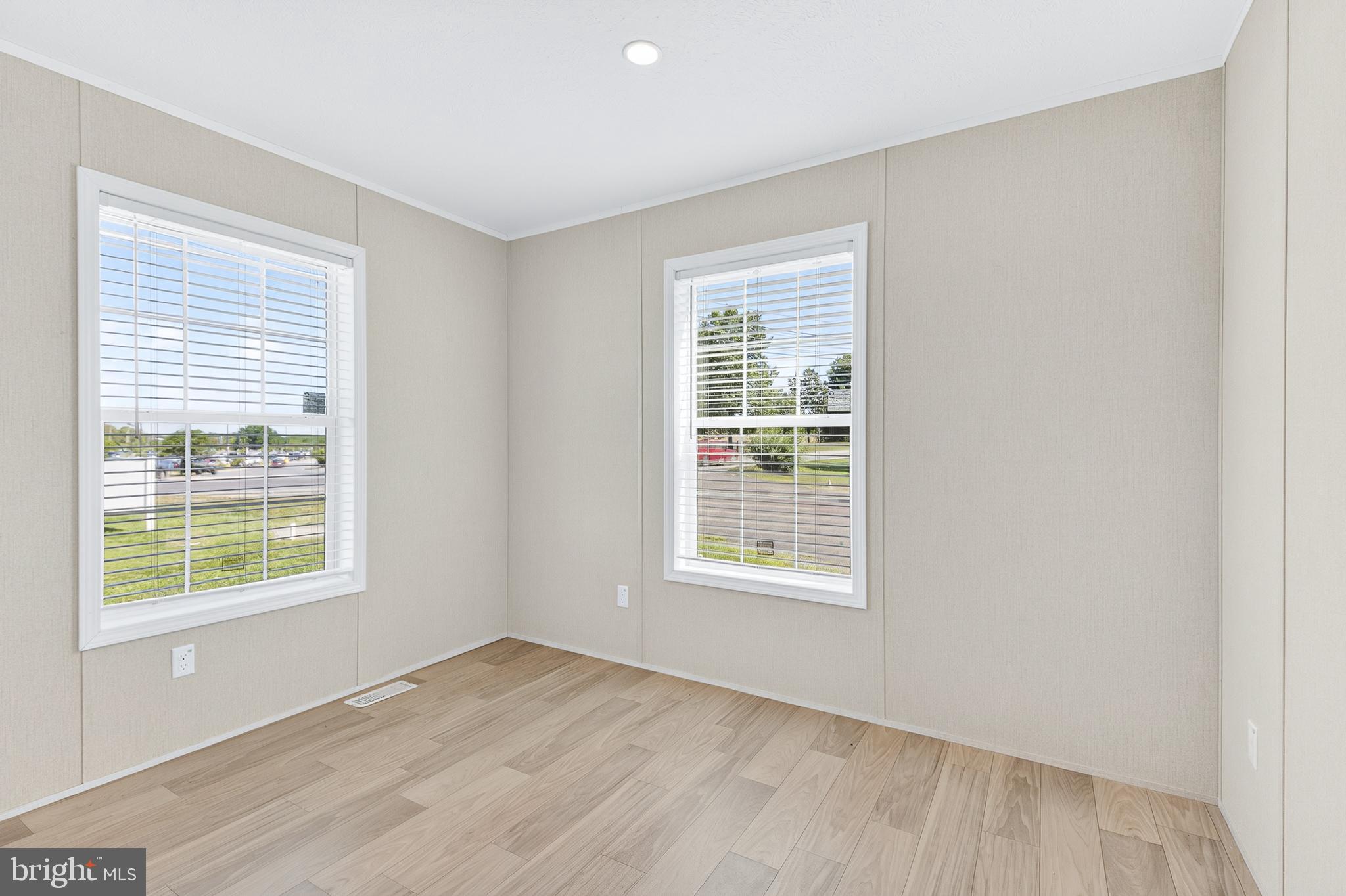201 Bordic Road Reading, PA 19606 - Photo 17 of 30 a view of an empty room with wooden floor and a window