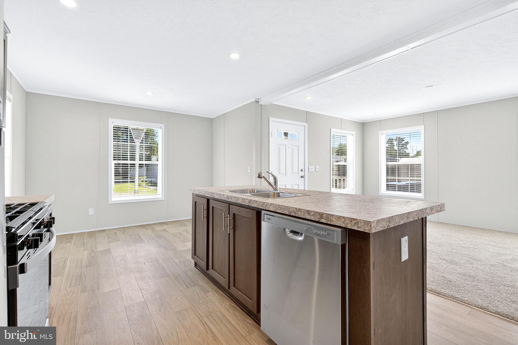 201 Bordic Road Reading, PA 19606 - Photo 19 of 30 a kitchen with stainless steel appliances granite countertop a sink and wooden cabinets