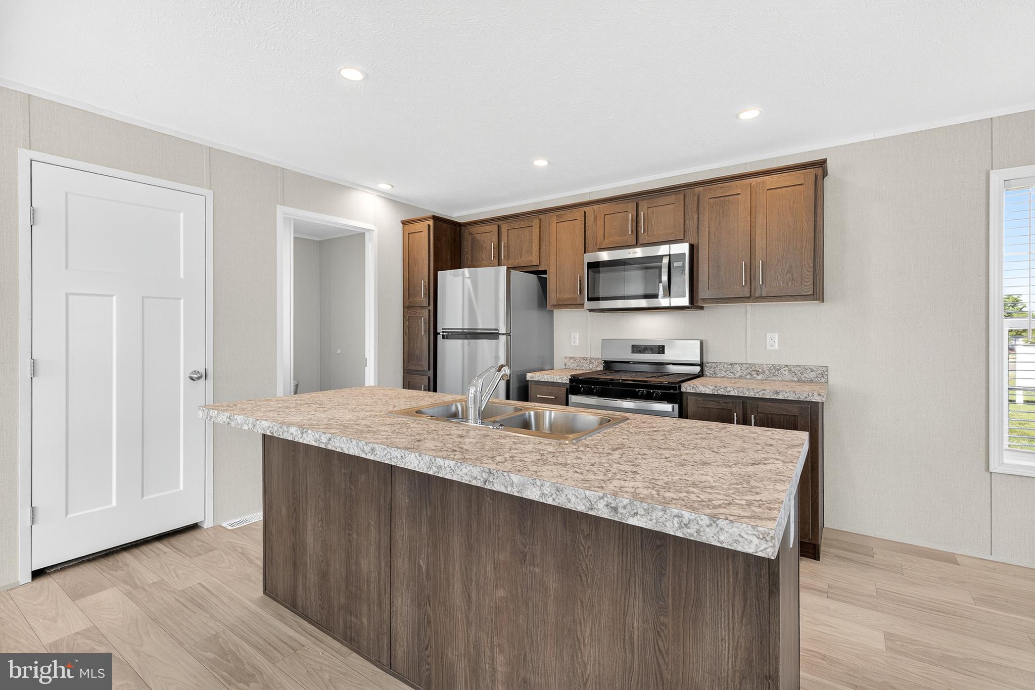 201 Bordic Road Reading, PA 19606 - Photo 21 of 30 a kitchen with granite countertop wooden cabinets and refrigerator