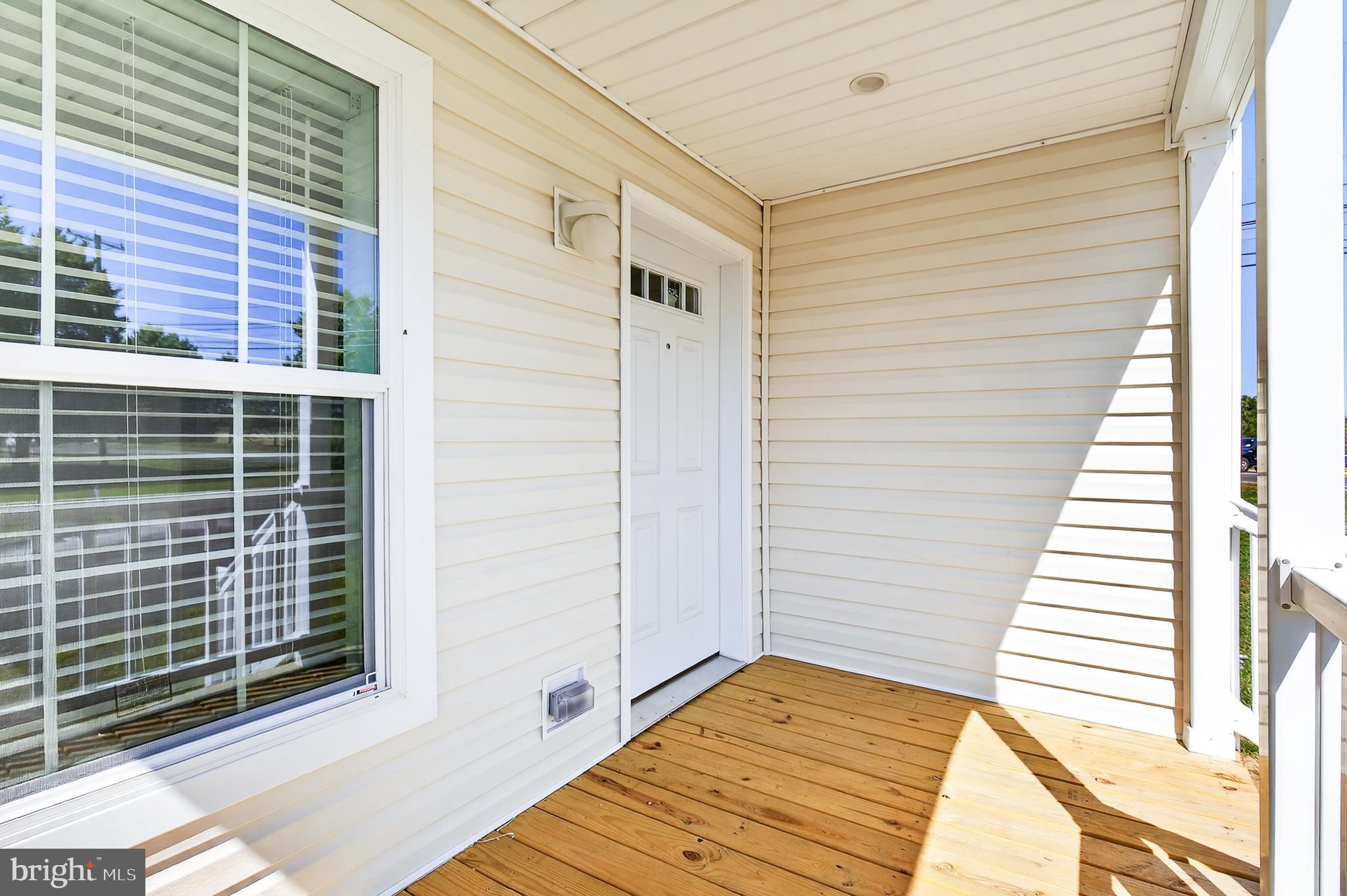 201 Bordic Road Reading, PA 19606 - Photo 26 of 30 a view of a balcony with wooden floor and windows