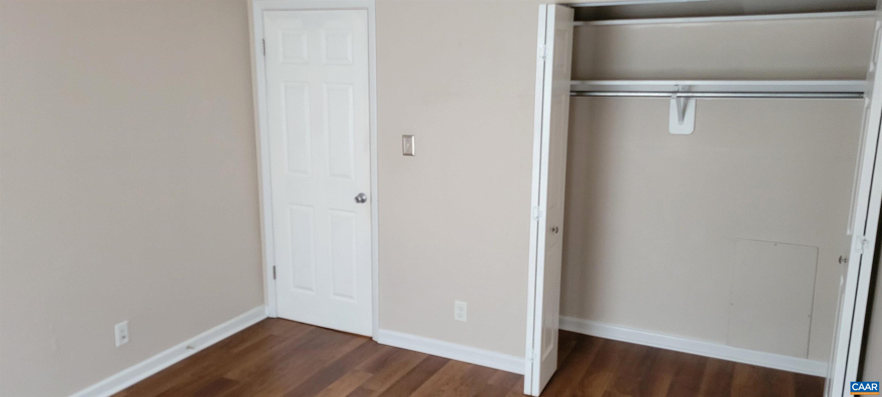 2527 Hydraulic Road, Unit 1 Charlottesville, VA 22901 - Photo 12 of 22 a view of an empty walk in closet