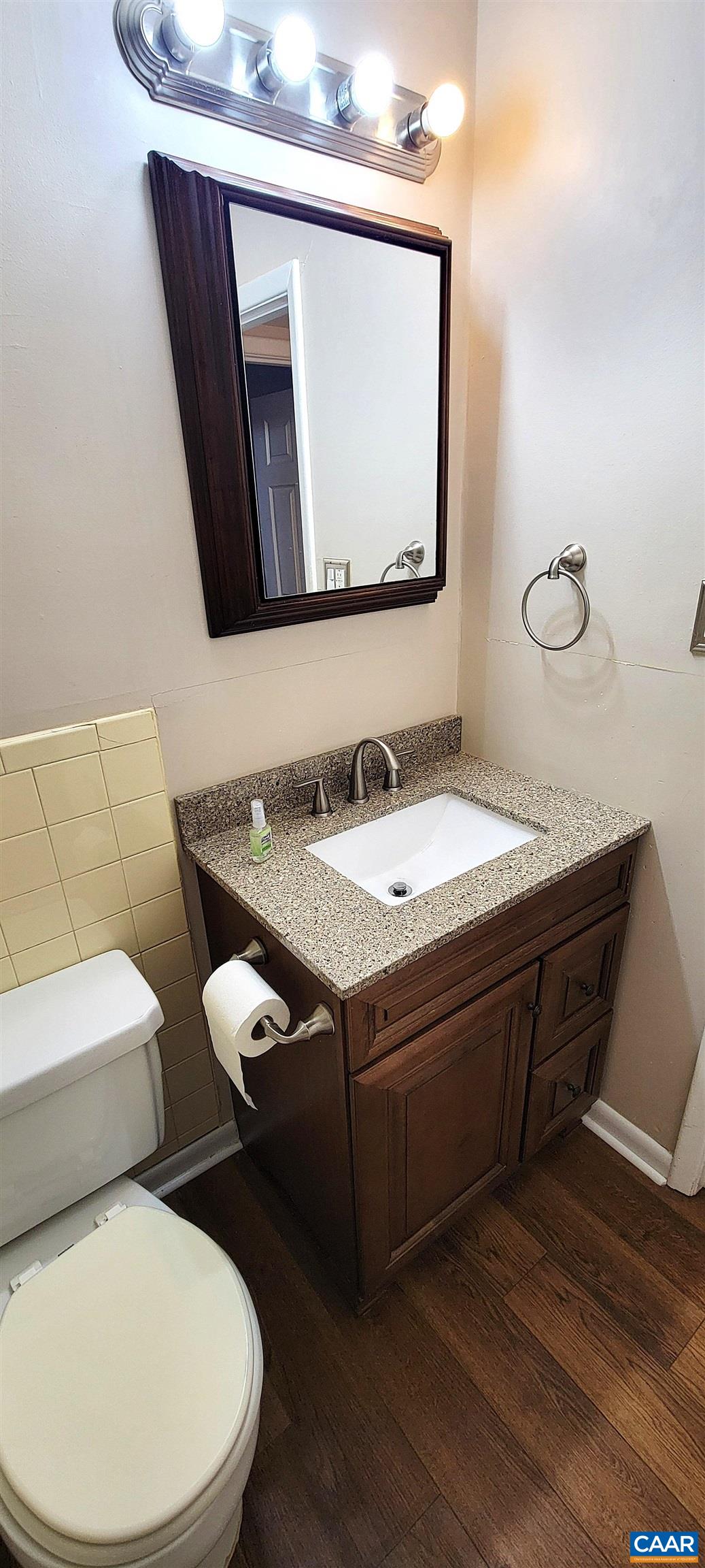 2527 Hydraulic Road, Unit 1 Charlottesville, VA 22901 - Photo 16 of 22 a bathroom with a toilet sink and mirror