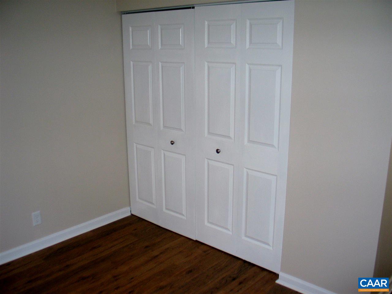 2527 Hydraulic Road, Unit 1 Charlottesville, VA 22901 - Photo 17 of 25 a view of empty room with wooden floor