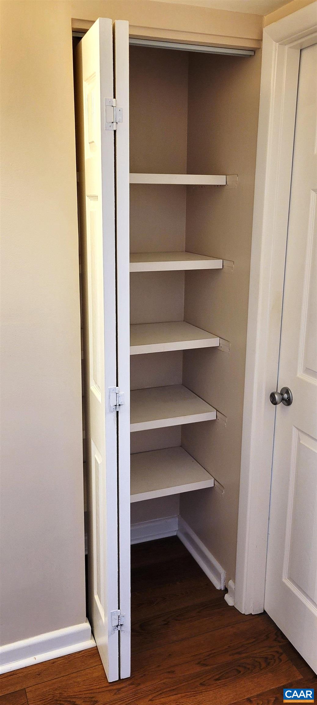 2527 Hydraulic Road, Unit 1 Charlottesville, VA 22901 - Photo 17 of 22 a view of a room with wooden floor