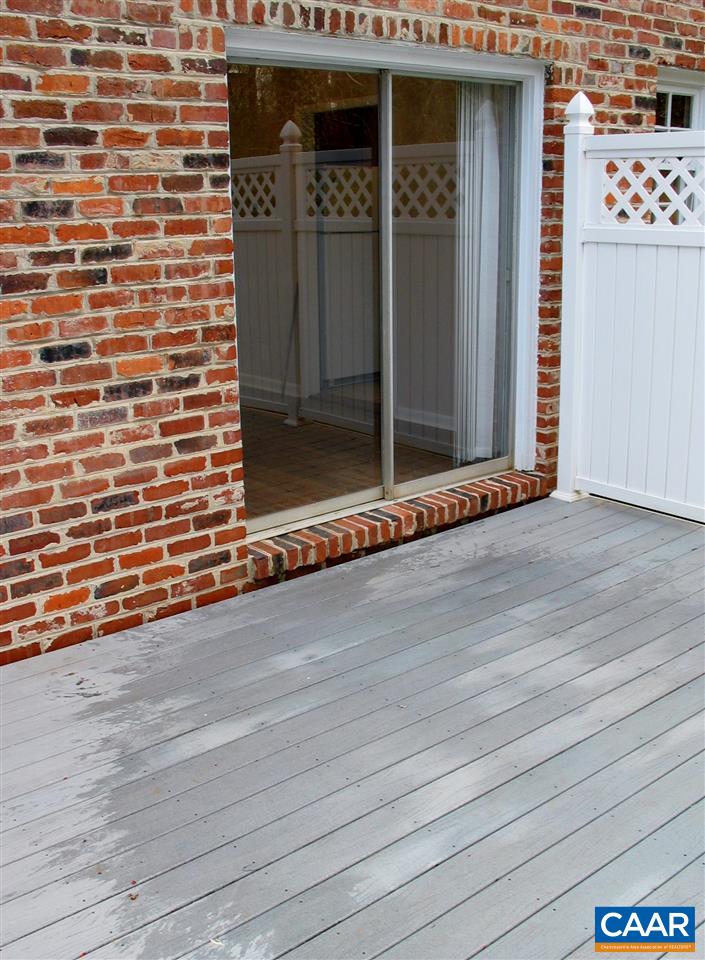 2527 Hydraulic Road, Unit 1 Charlottesville, VA 22901 - Photo 20 of 22 a view of a brick house with an empty space