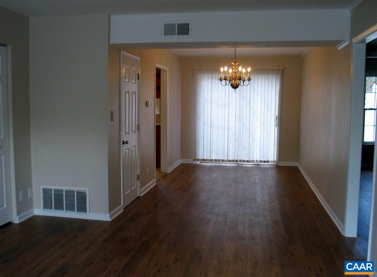 2527 Hydraulic Road, Unit 1 Charlottesville, VA 22901 - Photo 2 of 25 wooden floor in an empty room with a window