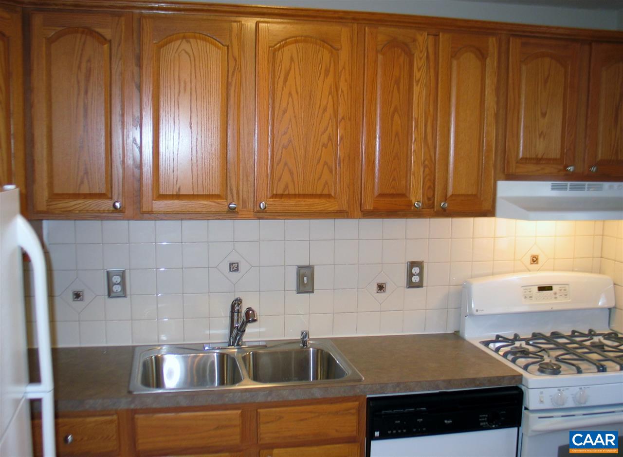 2527 Hydraulic Road, Unit 1 Charlottesville, VA 22901 - Photo 4 of 25 a kitchen with a sink and cabinets