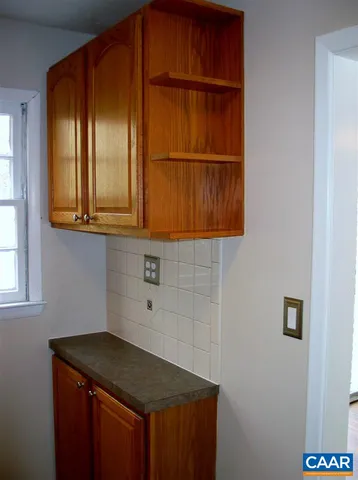 a kitchen with a refrigerator and a sink