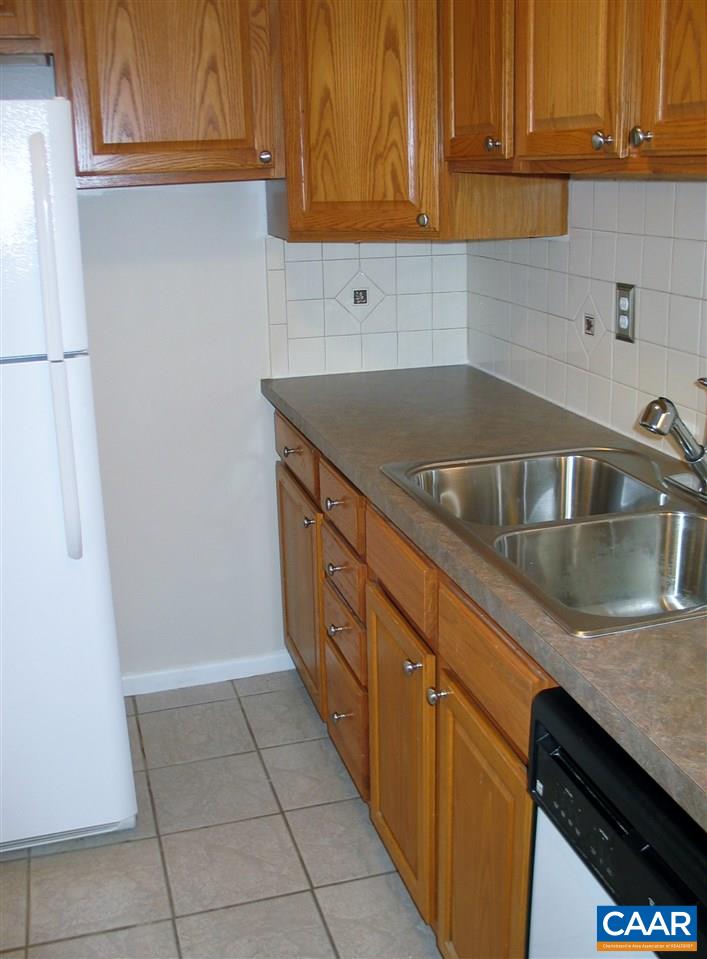 2527 Hydraulic Road, Unit 1 Charlottesville, VA 22901 - Photo 7 of 25 a kitchen with granite countertop a sink and cabinets