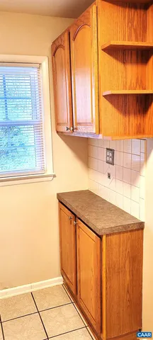 a kitchen with granite countertop a sink and a window