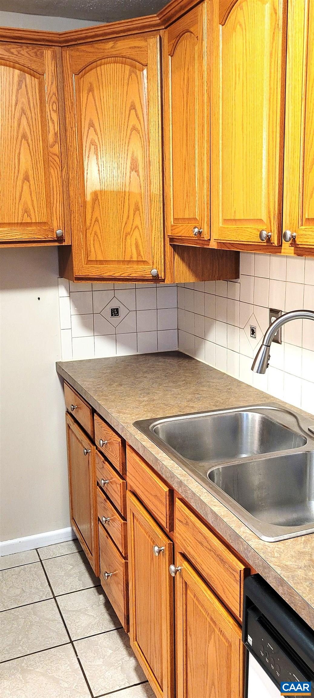 2527 Hydraulic Road, Unit 1 Charlottesville, VA 22901 - Photo 8 of 22 a kitchen with granite countertop a sink and a window
