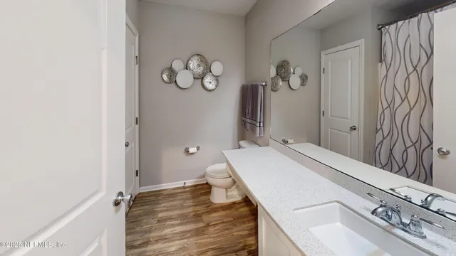 a room with a sink and a mirror