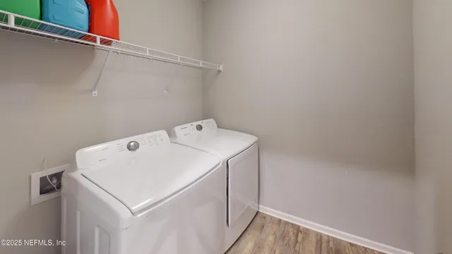 a utility room with dryer and washer