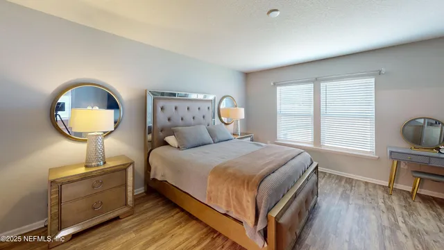 a bed room with a bed and a chair