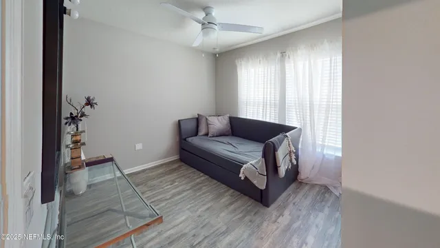 a living room with furniture and a rug