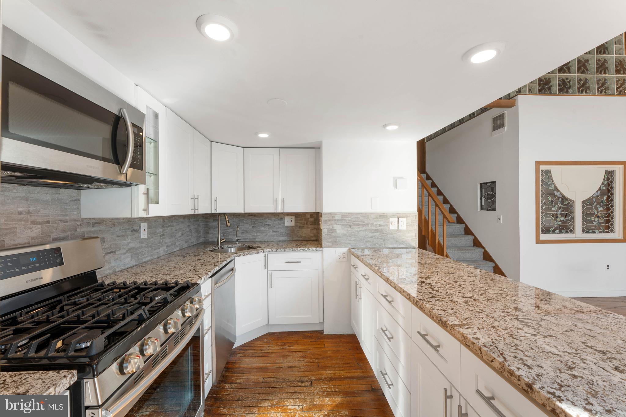 700 South 10th Street, Unit 2F Philadelphia, PA 19147 - Photo 15 of 40 a kitchen with a stove and a microwave
