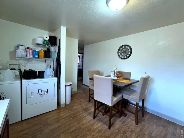 a view of a table and chairs in a kitchen